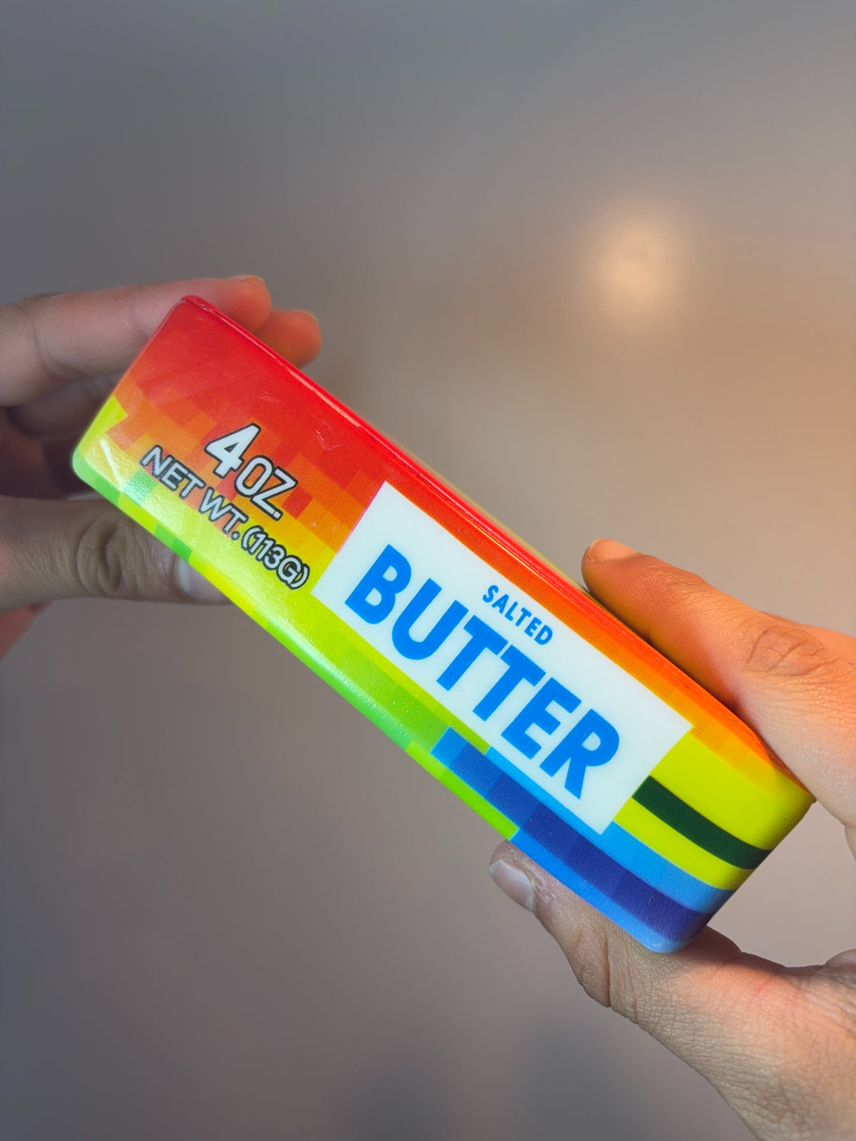 Butter squishy held in a hand