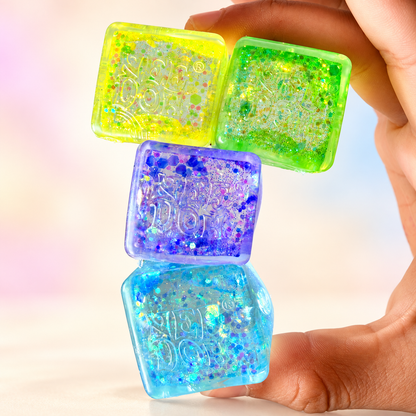 Mini glitter cube squishy 4-pack — bright background